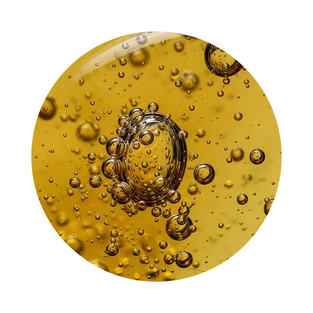 Circular macro image of jojoba oil drops symbolizing skin nourishment