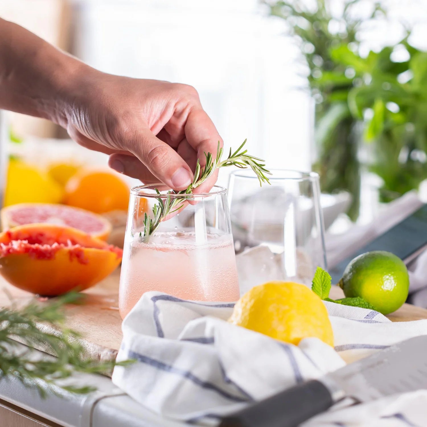Man taking a morning supplement capsule with water during her breakfast routine.