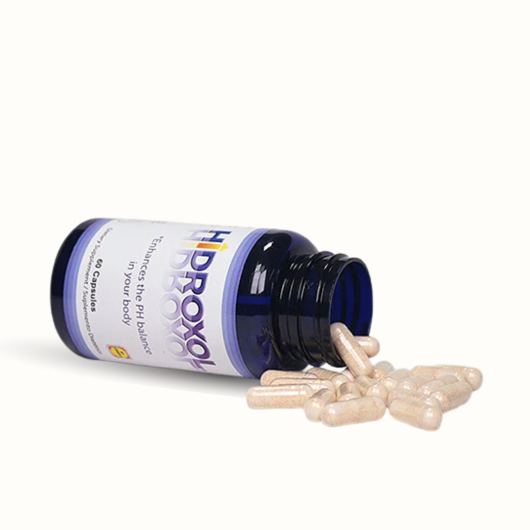 Open Hidroxol bottle with capsules spilling, natural pH balance and wellness supplement.
