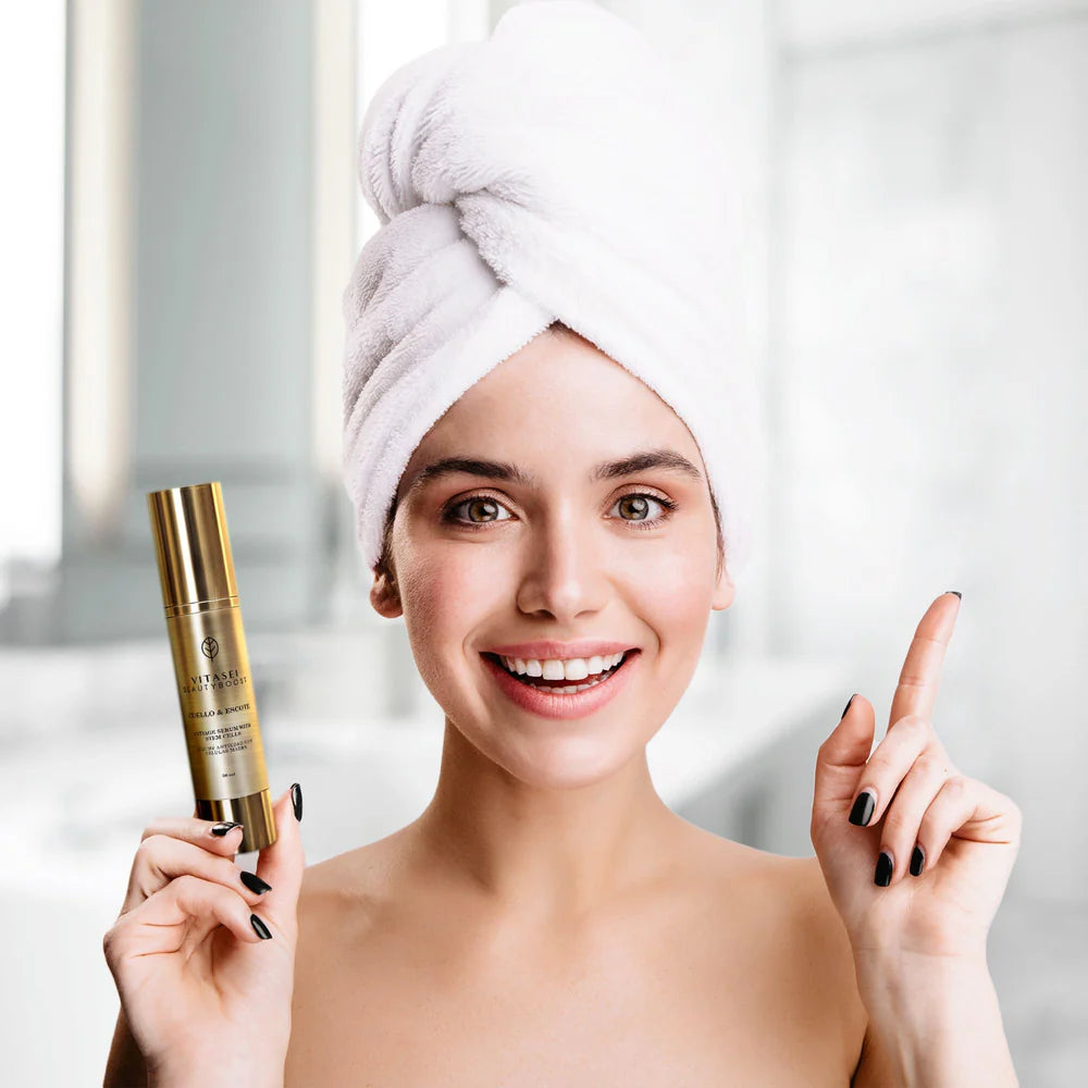Smiling model holding Vitasei neck & décolleté serum